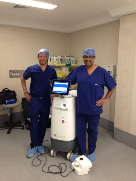 Dr Raji Kooner with a colleague beside a holmium laser platform